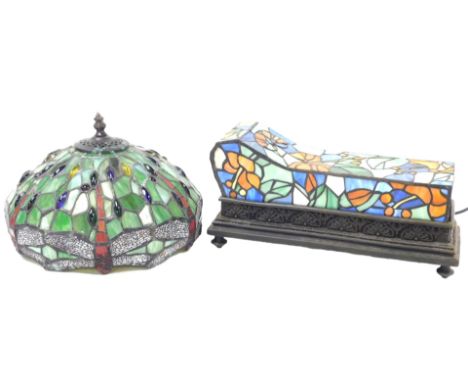 A Widdop Bingham &amp; Company Tiffany style table lamp, of chaise longue form, with a floral decorated glass shade, raised o
