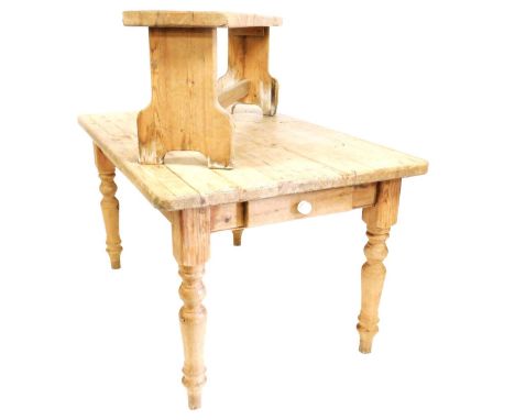 A Victorian pine kitchen table, with end frieze drawer, raised on turned legs, 78cm x 137cm x 92cm, together with a bench, ra