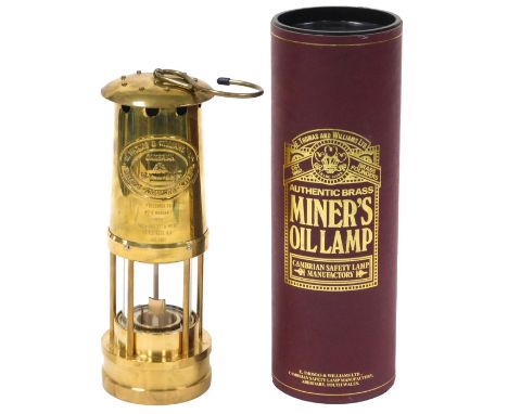 An E. Thomas &amp; Williams brass Cambrian miner's safety lamp, number 229493, presentation engraved, cased.
