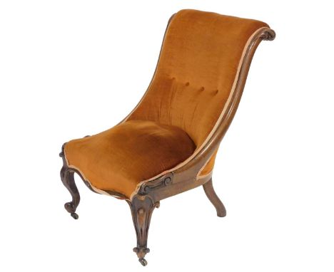 A Victorian mahogany scroll back nursing chair, upholstered in orange button back draylon, raised on carved cabriole legs, br