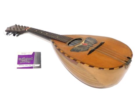 An early 20thC Neopolitan wooden cased mandolin, possibly Puglisi Reale &amp; Figli, cased.