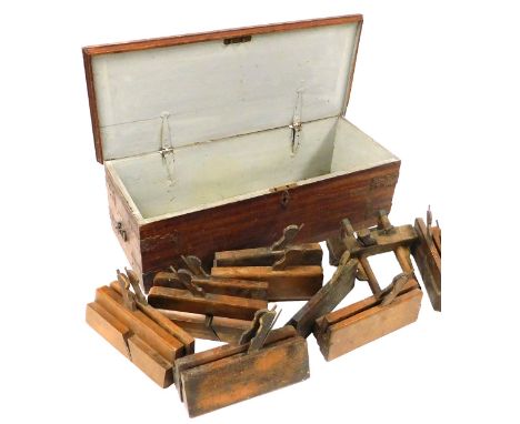 A group of moulding planes, and a plough plane, in a scumbled pine tool chest, 69cm wide. 