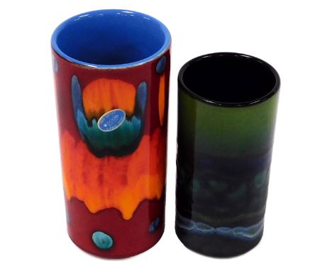A Poole Pottery Volcano pattern vase, of cylindrical form, raised marks and paper label, 20.5cm high, together with a Maya pa