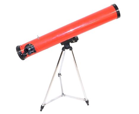 A Tasco night telescope, with tripod and instructions, boxed.