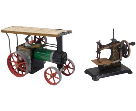 A Mamod steam tractor TE1A, together with a German Casige child's toy sewing machine, 15.5cm wide.