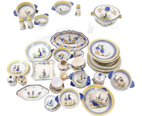 A group of Quimper pottery, traditionally decorated with figures in Breton costume, painted marks, including a tureen, twin h