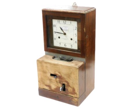 A mid century wooden cased clocking in clock, with a square enamel dial bearing Arabic numerals, 69cm high, 36cm wide, 30.5cm