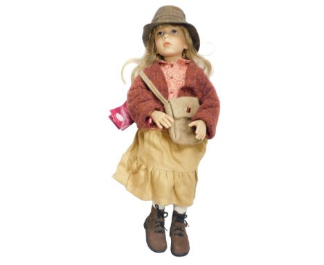 A Gotz doll, modelled with a hemp skirt and floral blouse, designed by Elizabeth Lindner, limited edition 34/500, with certif
