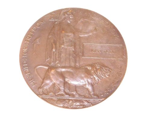 A WWI bronze Widow's Penny, named for John Dodd, with cardboard casing.