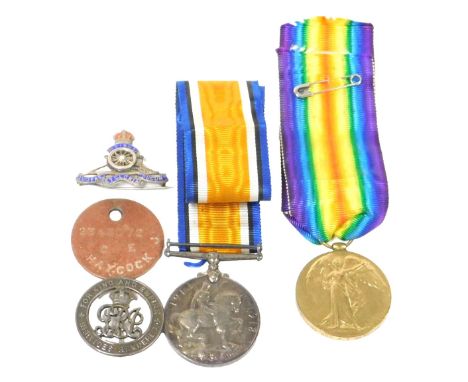A pair of WWI medals, comprising Great War and Victory medals, named to Gnr J. T. Haycock RA, 7068, together with a silver Wo