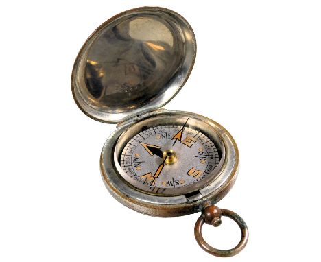 A World War I Dennison military pocket compass 1917, mark VI, number 121075.