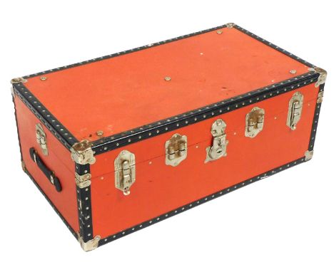 A red canvas cabin trunk, with white metal strap work, hinges and lock plate, 36cm x 93cm x 51cm.