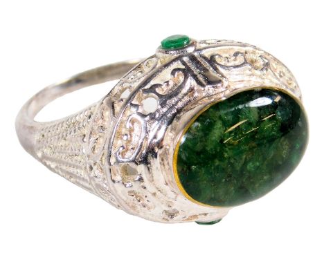 A cabochon jade and CZ ring, in an oval mount, white metal, engraved Karis, size W.