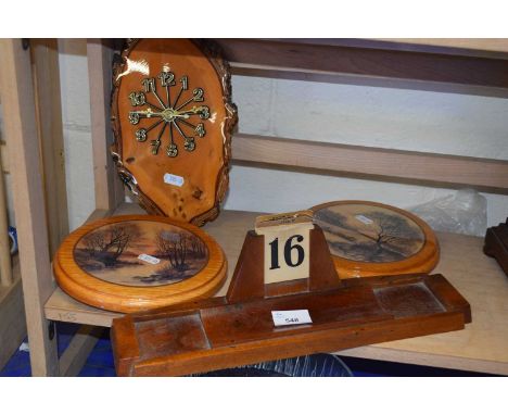 Wooden desk calendar together with a wall clock and two wall plaques