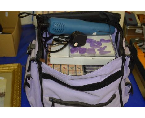 Craft caddy together with a quantity of crafting stamps and other items