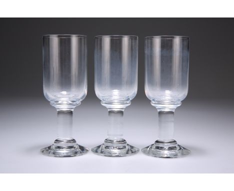 A SET OF THREE LATE VICTORIAN SHERRY OR SPARKLING WINE GLASSES, each with deep cylindrical bowl, raised on a columnar stem wi