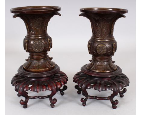 A PAIR 0F 19TH/20TH CENTURY CHINESE BRONZE GU VASES, together with fitted wood stands, 8in high overall on stands, the vases 