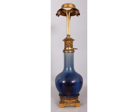 A GOOD 19TH CENTURY ORMOLU MOUNTED CHINESE FLAMBE GLAZED PORCELAIN VASE, fitted for electricity, with an oil lamp neck fittin