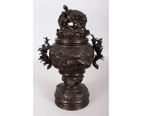 A JAPANESE MEIJI PERIOD BRONZE KORO & COVER, the cover cast with an elaborate dragon finial, 12.25in high overall.