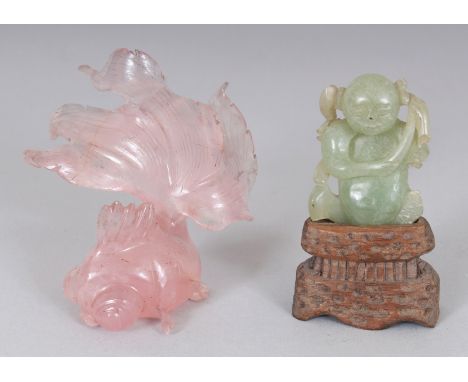 A CHINESE ROSE QUARTZ MODEL OF AN ANGEL FISH, 3.25in long; together with a small celadon jade figure of a boy on a fitted woo
