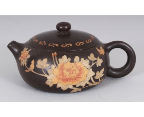 A CHINESE YIXING POTTERY TEAPOT & COVER, the sides decorated with calligraphy and with a spray of peony, the underside of the