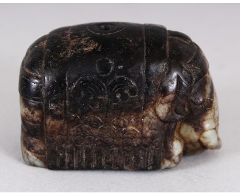 A CHINESE CELADON GREEN & DARK BROWN JADE MODEL OF A CAPARISONED ELEPHANT, 1.9in long & 1.25in high.