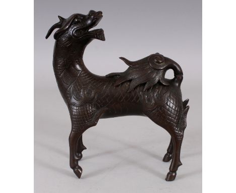 A CHINESE BRONZE KYLIN CENSER, its hinged tail forming the cover, 6.8in long & 7.8in high.
