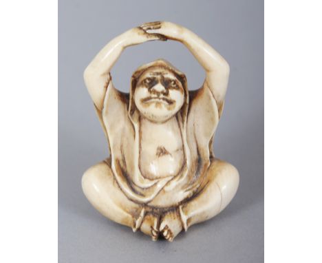 A SIGNED JAPANESE MEIJI PERIOD IVORY NETSUKE OF DARUMA, seated and with his raised arms forming the himotoshi, the base with 