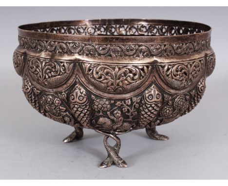 A 19TH/20TH CENTURY INDIAN SILVER-METAL EMBOSSED & PIERCED TRIPOD BOWL, weighing approx. 670gm, the base with a fish mark, 8i