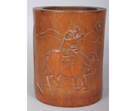 A SIGNED 19TH CENTURY CHINESE BAMBOO BRUSHPOT, carved with calligraphy and with a boy riding a water buffalo, 4.6in wide at w