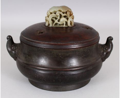 A CHINESE BRONZE CENSER, together with a wood cover fitted with a pierced celadon jade lotus finial, the bronze itself weighi