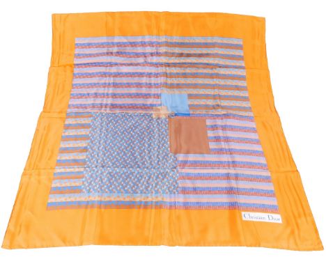 A 20thC Christian Dior silk scarf, in geometric pattern predominately in orange, blue, brown and pink, 71cm x 73cm.