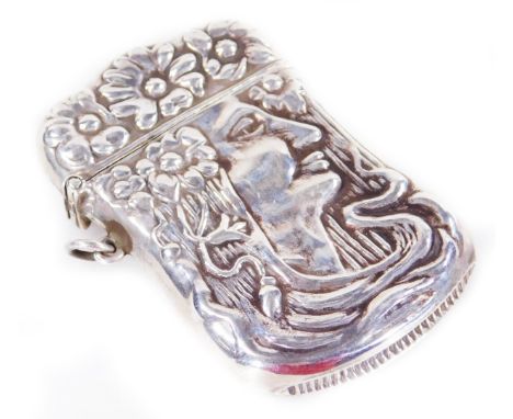 A 20thC vesta case, of shaped outline, repoussé decorated with Art Nouveau style figure of a lady with flowers, shaped top, m