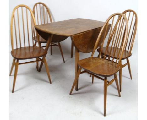 An Ercol lightwood drop leaf dining table, on square supports, (when closed) 73cm H, 114cm W, 62cm D, with four stick back ch