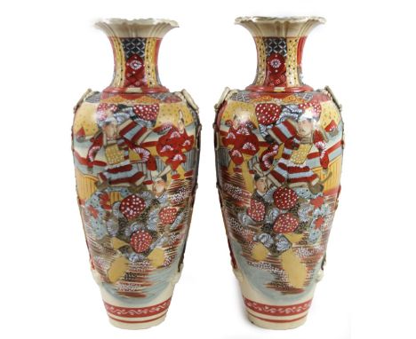 A pair of late 19thC satsuma pottery Samurai vases, with squat trumpet stems and shouldered bodies with moulded ring handles,