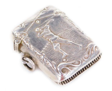 An early 20thC vesta case, golfing related, repoussé decorated with a figure in full swing, surmounted by two golf clubs with