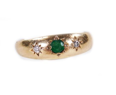 A 9ct gold dress ring, with central emerald, flanked by two diamonds, on a plain shank, size K, 2½g all in.