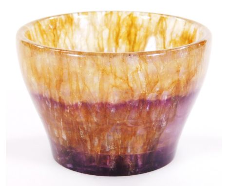 A Blue John bowl, of compressed circular outline, with inverted body, in light amethyst, orange and clear colours, 7cm dia.