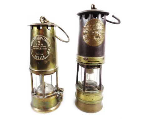 A mid 20thC Hailwoods approved miner's lamp, of cylindrical outline with glass centre on a circular foot, with swing hook han