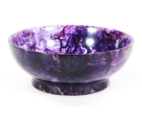 A Blue John bowl, of circular outline, on circular foot, in deep amethyst colours, 10cm dia.