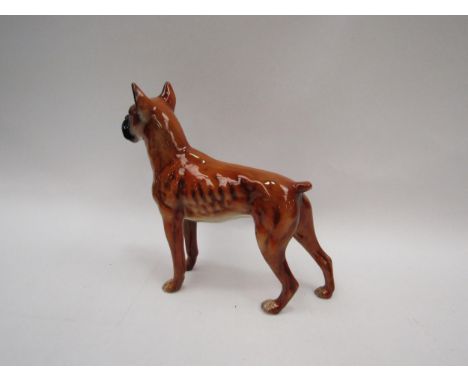 A West German Goebel boxer dog figurine, hand-painted, 17cm tall 