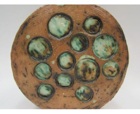 A Studio Pottery vase of moon flask style form, green glazed roundels, 23.5cm tall 