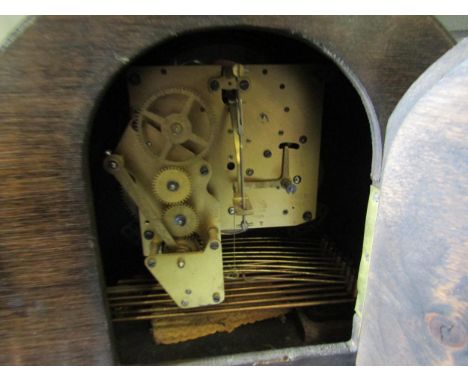 An oak cased mantle clock 