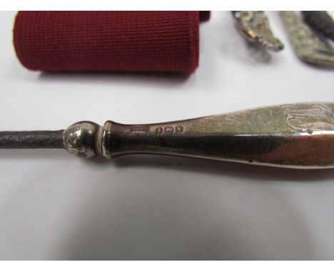A white nurses belt and two silver handled button hooks etc 