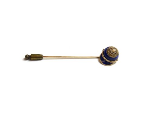 A late Victorian gold and blue enamelled simulating lapis lazuli stick pin, modelled as a jockey's cap to the terminal and wi