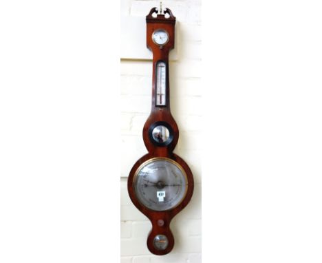 A Victorian rosewood cased wheel barometer by 'E. Hayward, Ashford', with broken arch pediment over thermometer, bullseye mir