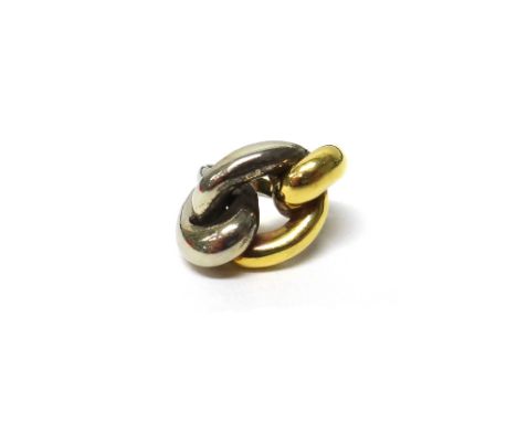 A two colour gold ring, in an oval and twin loop shaped twistover design, ring size J and a half, weight 9.5 gms.