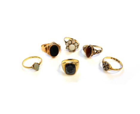 A gold and bloodstone set oval signet style ring, a gold ring, mounted with an oval opal, a gold and opal set cluster ring (o