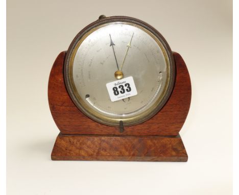 A brass cased table aneroid barometer, presentation engraved to the rear and dated 1862, housed in a mahogany and walnut fram