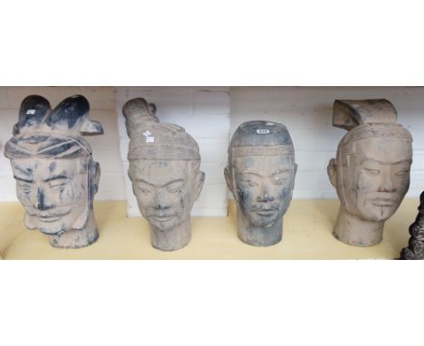 A set of four modern pottery terracotta army figure heads, the tallest 41cm high.